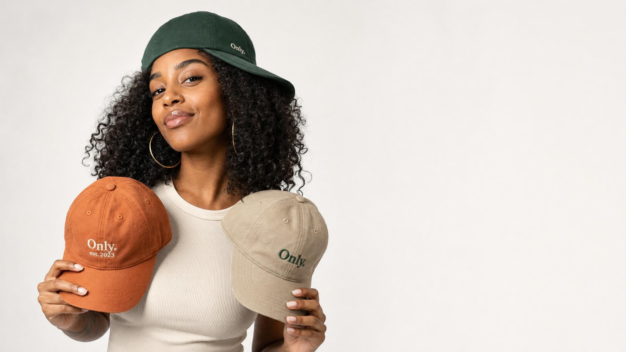 A vibrant collection of eco-friendly customizable hats displayed in a natural setting
